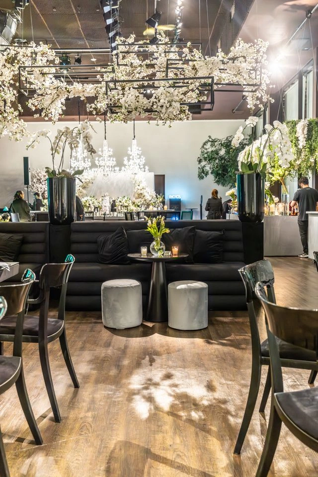 Kinetic floral scenography with cascading chandeliers